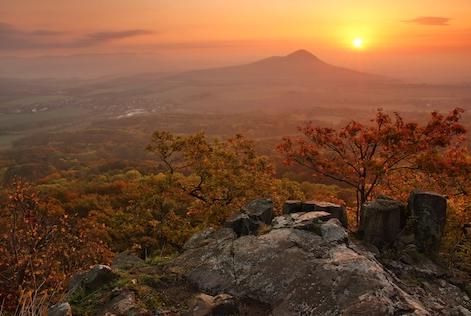 a panorama of forest and a village